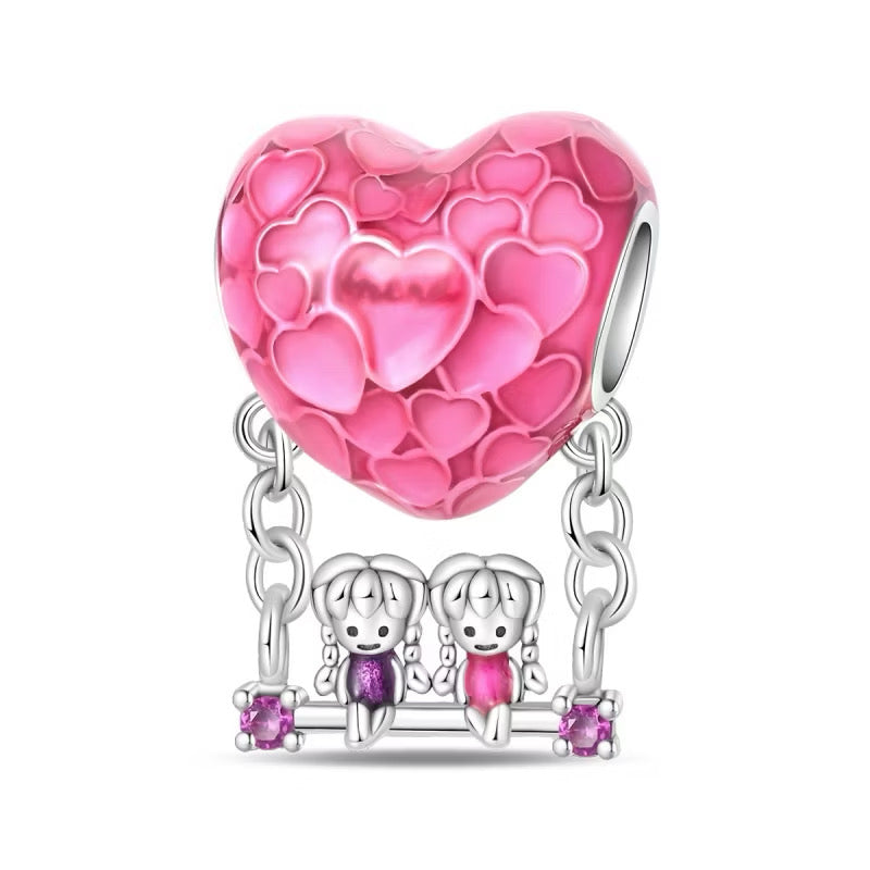 Charm Corazon Rosa con Columpio