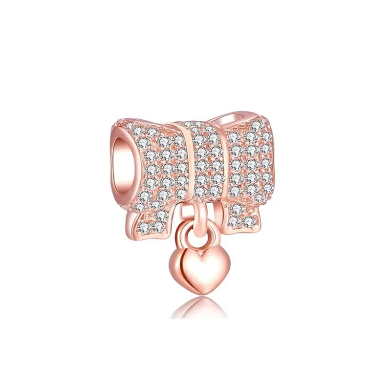 Charm Moños Rosa Oro con Diamantes