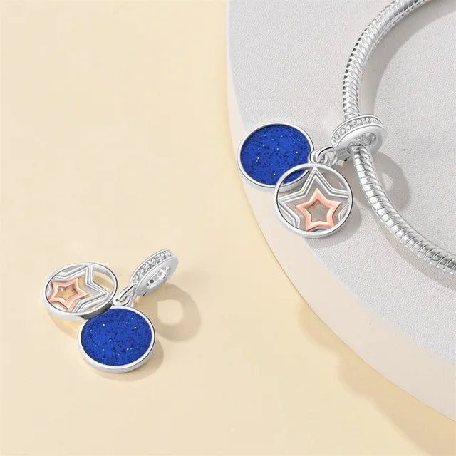 Charm Estrella Plata y Rosa Oro con Fondo Azul