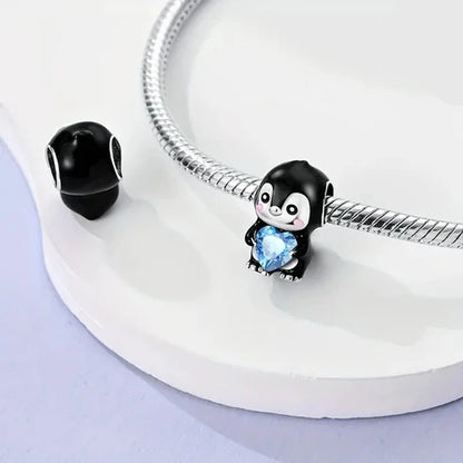 Charm Pinguino y Corazon Azul